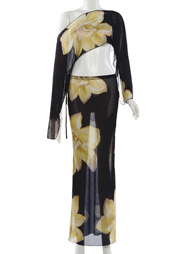 Ensemble femme deux pièces avec haut asymétrique et jupe longue