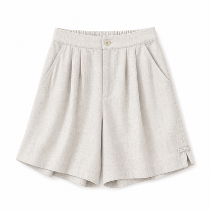 Short femme taille haute avec fermeture boutonnée, plis et poches latérales